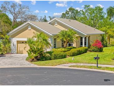 Charming single-story home with a well-maintained lawn and inviting curb appeal on a sunny day at 9020 Eagle Bay Ct, North Port, FL 34287