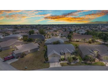 Gorgeous community aerial view showcasing home at sunset with mature landscaping and beautiful neighborhood at 1848 Birmingham Blvd, Port Charlotte, FL 33980