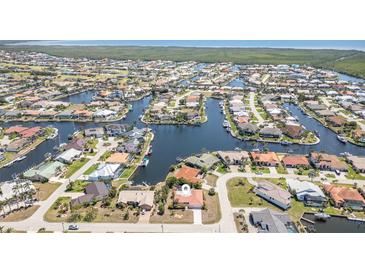 Stunning aerial view of waterfront homes with canals and boat docks in a desirable coastal community at 2621 Via Veneto Dr, Punta Gorda, FL 33950