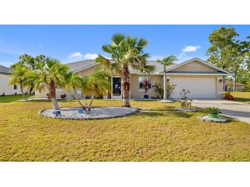 Charming home featuring lush landscaping and a well-maintained front yard, perfect for curb appeal at 25313 Durango Ct, Punta Gorda, FL 33955