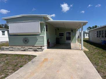 Charming single-story home with a covered carport and well-maintained lawn at 5025 Palena Blvd., North Port, FL 34287