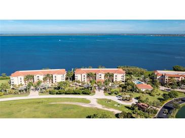 Beautiful waterfront condo complex with lush landscaping and stunning water views at 95 N Marion Ct # 226, Punta Gorda, FL 33950