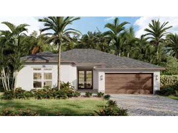 Charming single-story home with a two-car garage, neutral color palette, tropical landscaping, and inviting entrance at 489 Guild St, Port Charlotte, FL 33954
