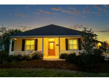 Charming single-story home with a welcoming front porch and well-maintained landscaping at 2227 Bonn Ct, Punta Gorda, FL 33983