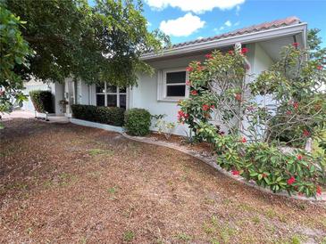Well-maintained single-story home with tidy landscaping and curb appeal at 931 Juno Dr, Punta Gorda, FL 33950