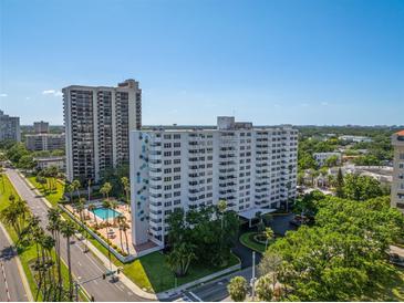 Stunning aerial view of Harbour House condo complex with pool, mature landscaping, and city views at 2401 Bayshore Blvd # 1204, Tampa, FL 33629