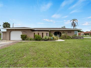 Charming single-story home with a well-manicured lawn and attractive landscaping in a great neighborhood at 3561 Middletown St, Port Charlotte, FL 33952