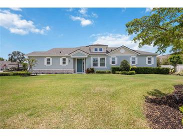 Charming single-story home featuring a well-manicured lawn, beautiful landscaping, and impeccable curb appeal at 3664 Tin Cup Blvd, Sarasota, FL 34232