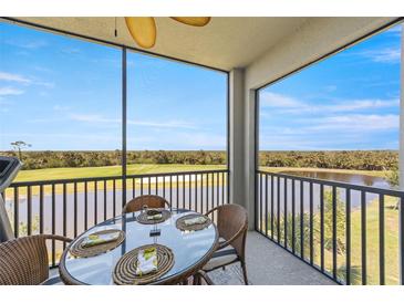 Enjoy the view from the screened-in balcony, furnished with a glass-top table and wicker chairs overlooking the golf course at 14051 Heritage Landing Blvd # 536, Punta Gorda, FL 33955