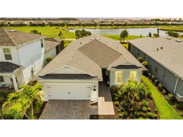 Stunning aerial view of a well-kept home with a lush green lawn, picturesque landscaping and charming neighborhood views at 15830 Appalachian Dr, Punta Gorda, FL 33982