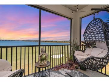 Relaxing patio with comfortable seating and stunning views of the golf course and colorful evening sky at 43050 Greenway Blvd # 645, Punta Gorda, FL 33982