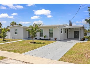 Charming single-story home boasts a well-manicured lawn and convenient carport for covered parking at 6309 Pontiac Ln, North Port, FL 34287