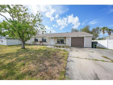 Charming single-story home with a well-maintained lawn and an attached one car garage at 4243 Hokan Ave, North Port, FL 34287