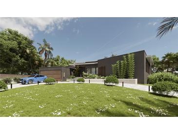 Stunning exterior elevation with a modern design, lush landscaping, and a charming blue car parked nearby at 2523 Ryan Blvd, Punta Gorda, FL 33950