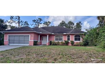 Charming one-story home with a well-manicured lawn and inviting curb appeal at 2585 Yuma Ave, North Port, FL 34286
