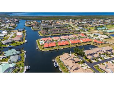 Beautiful aerial view of waterfront community with canals and access to open water at 3800 Bal Harbor Blvd # 415, Punta Gorda, FL 33950
