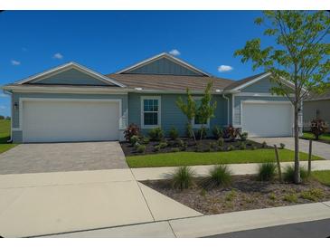 Charming single-story home with a two-car garage and well-maintained landscaping at 16909 Caracara Pl, Punta Gorda, FL 33982