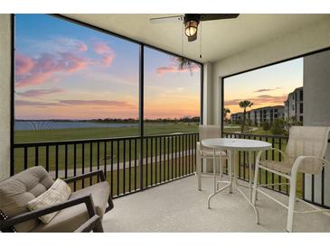 Enjoy the lovely screened patio featuring comfortable seating and serene golf course and sunset views at 43030 Greenway Blvd # 426, Punta Gorda, FL 33982