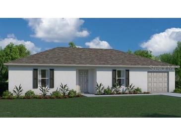 Charming single-story home featuring a manicured lawn, crisp white exterior, and attached two-car garage at 15201 Community Ave, Port Charlotte, FL 33953
