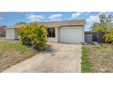 Charming single-story home features a two-car garage and well-maintained lawn at 4282 Pocatella Ave, North Port, FL 34287