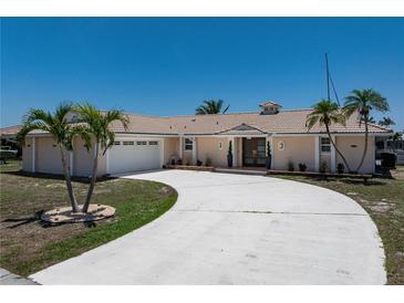 Charming single-story home boasting a well-maintained lawn, inviting entrance, and a convenient two-car garage at 259 Fields Ter, Port Charlotte, FL 33952