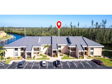A well maintained building with parking, landscaping and canal access at 3256 White Ibis Ct # 24A, Punta Gorda, FL 33950