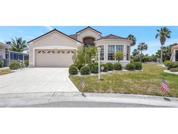 Charming single-story home with well-manicured landscaping and a two-car garage at 10263 Shadow Run Cir, Punta Gorda, FL 33955