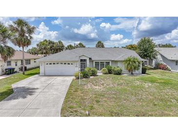 Charming single story home with manicured lawn and mature trees at 4055 Alwick Ln, North Port, FL 34287