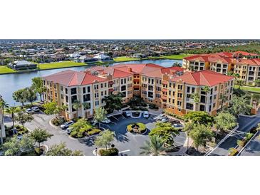 Stunning aerial view of a luxurious condominium complex with well-manicured landscaping and water views at 96 Vivante Blvd # 9622, Punta Gorda, FL 33950