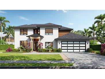 Elegant two-story home boasts lush landscaping, a stylish garage door, and a welcoming front entrance at 12299 Albrecht Ter, Port Charlotte, FL 33981