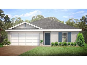 Charming single-story home featuring a manicured lawn, a blue front door, and a two car garage at 18139 Regan Ave, Port Charlotte, FL 33948