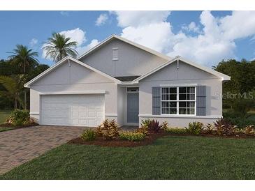 Charming one-story home with a two-car garage, neutral paint, and landscaping at 18147 Regan Ave, Port Charlotte, FL 33948