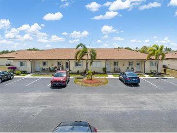 Well-maintained condo building with lush landscaping, ample parking, and charming curb appeal in a desirable community at 25275 Rampart Blvd # 1504, Punta Gorda, FL 33983