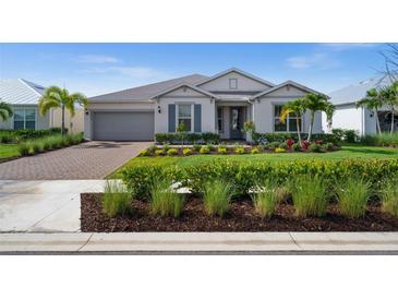 Charming single-story home with manicured lawn, stone driveway, and inviting curb appeal at 42346 Waterfront Way, Punta Gorda, FL 33982