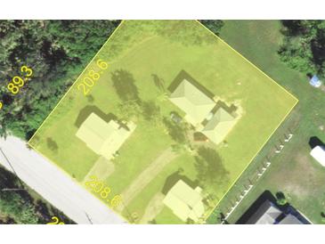 Aerial view of property boundaries, outlining the home and surrounding land at 28024 Cleveland Ave, Punta Gorda, FL 33982