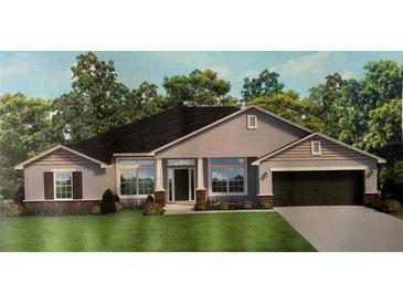 Charming single-story home featuring a two-car garage, landscaped yard, and a welcoming front porch at 9469 Spring Cir, Port Charlotte, FL 33981