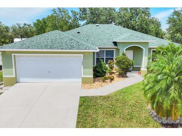 Charming one-story home with a well-manicured lawn and lush landscaping in a peaceful neighborhood at 7280 Muncey Rd, North Port, FL 34291
