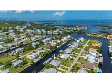 Waterfront home featuring direct access to the Gulf with dock and lift, perfect for boating enthusiasts at 24261 Captain Kidd Blvd, Punta Gorda, FL 33955