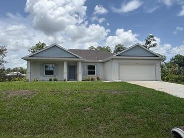 Charming single-story home with a well-manicured lawn and inviting curb appeal at 2534 Longworthy Rd, North Port, FL 34288