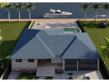 Stunning waterfront home featuring a private pool, boat dock, and beautifully landscaped yard at 24317 Treasure Island Blvd, Punta Gorda, FL 33955