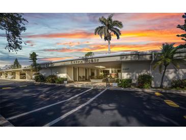 The Essex House features a well maintained entrance with beautiful landscaping and ample parking at 2437 Harbor Blvd # 114, Port Charlotte, FL 33952