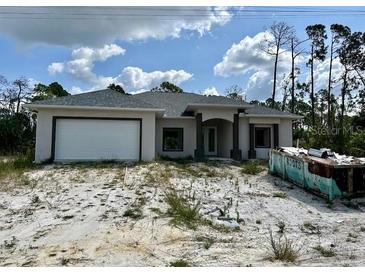 Newly built home with a two-car garage at 3084 Shawnee Ter, North Port, FL 34286