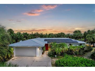 House with solar panels and landscaped yard at 120 Barracuda Dr, Placida, FL 33946