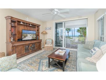 Beachfront living room with ocean view and comfortable furnishings at 7536 Palm Island S Dr # 1511, Placida, FL 33946