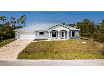 Single-Gathering home with metal roof and paver driveway at 8099 Walbert St, Port Charlotte, FL 33981