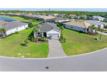 Single-Gathering home with paver driveway at 14756 Ponce De Leon Trl, Port Charlotte, FL 33981