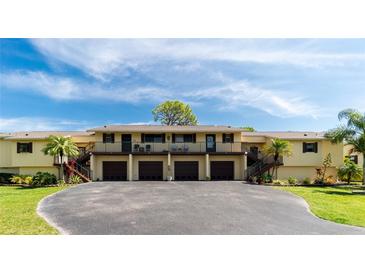 Two-story building with attached garages at 4260 Placida Rd # 9B, Englewood, FL 34224