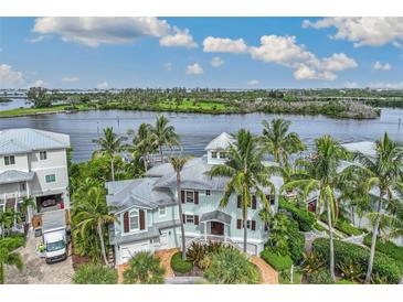 Luxury waterfront home with private dock and stunning canal views at 13310 Anglers Way, Placida, FL 33946