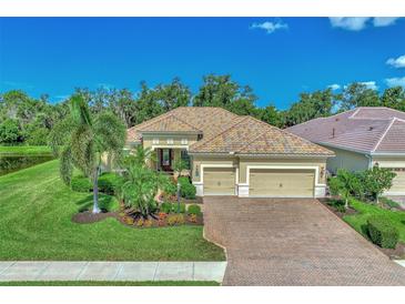 Stunning home with attractive landscaping and two-car garage at 27453 Hole In One Pl, Englewood, FL 34223