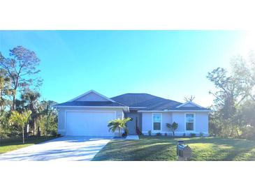 Two-story home with a white exterior, gray roof, and a two-car garage at 9174 Bensonhurst Ln, Englewood, FL 34224